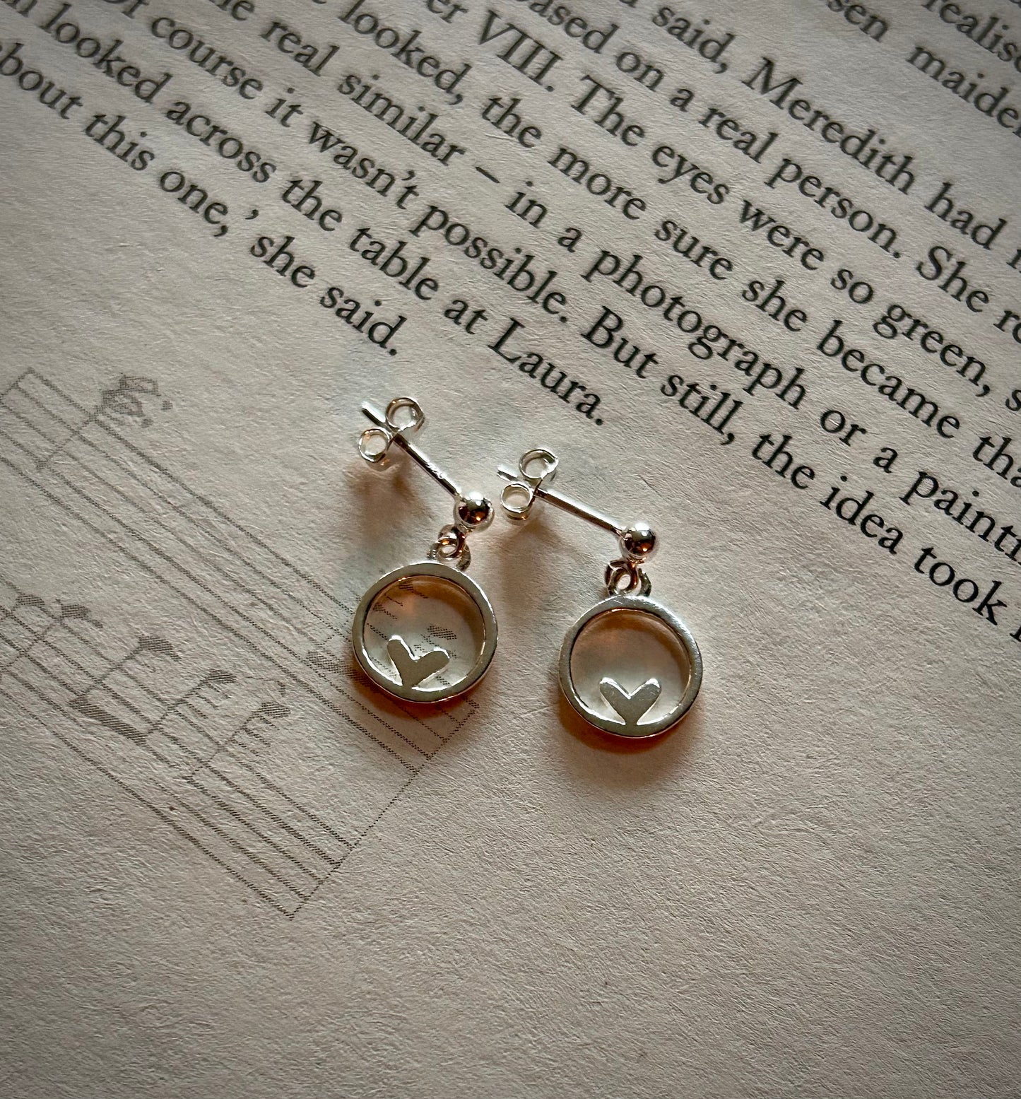 Heart in circle dangly stud earrings