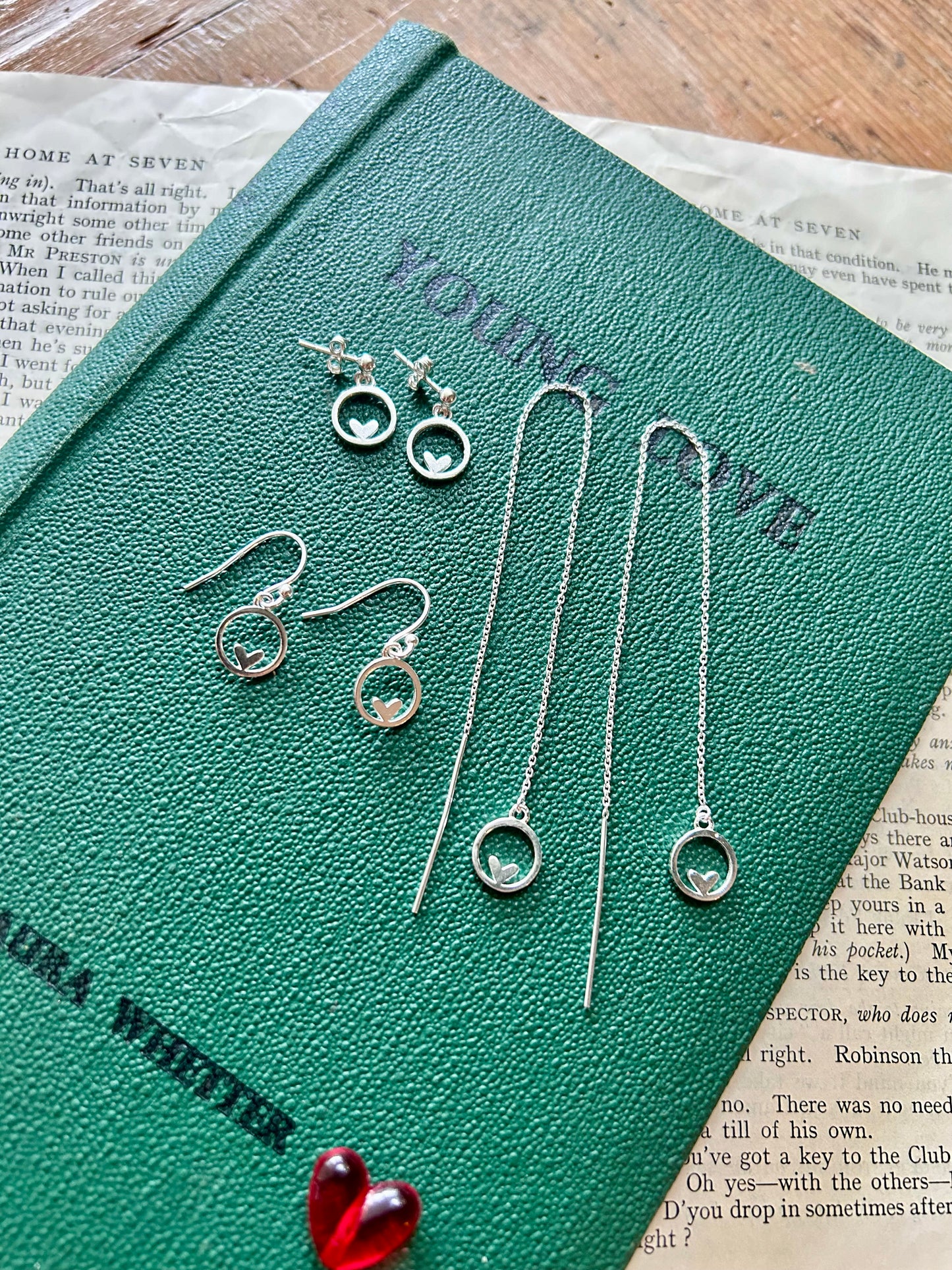 Heart in circle dangly stud earrings
