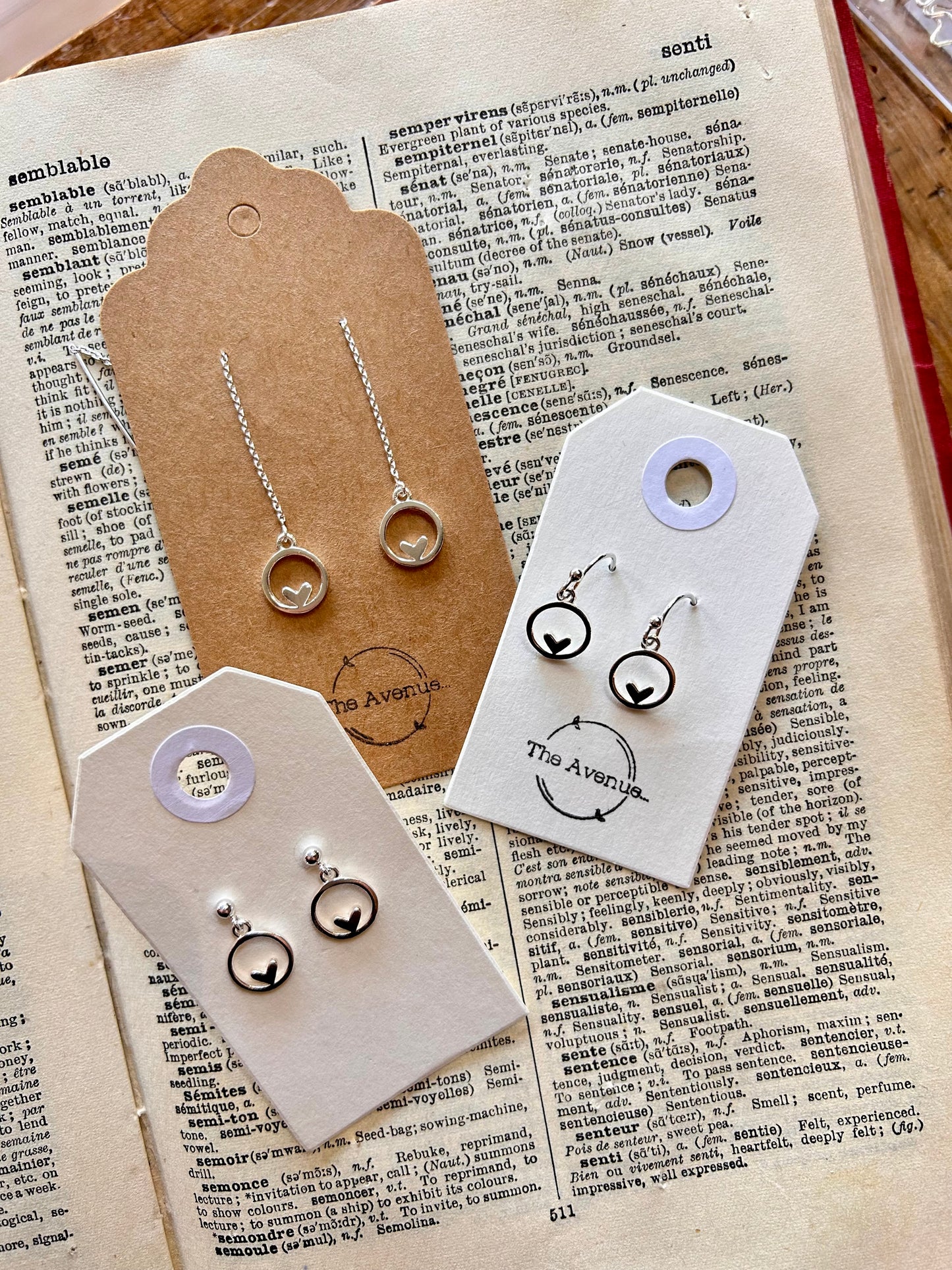 Heart in circle dangly stud earrings