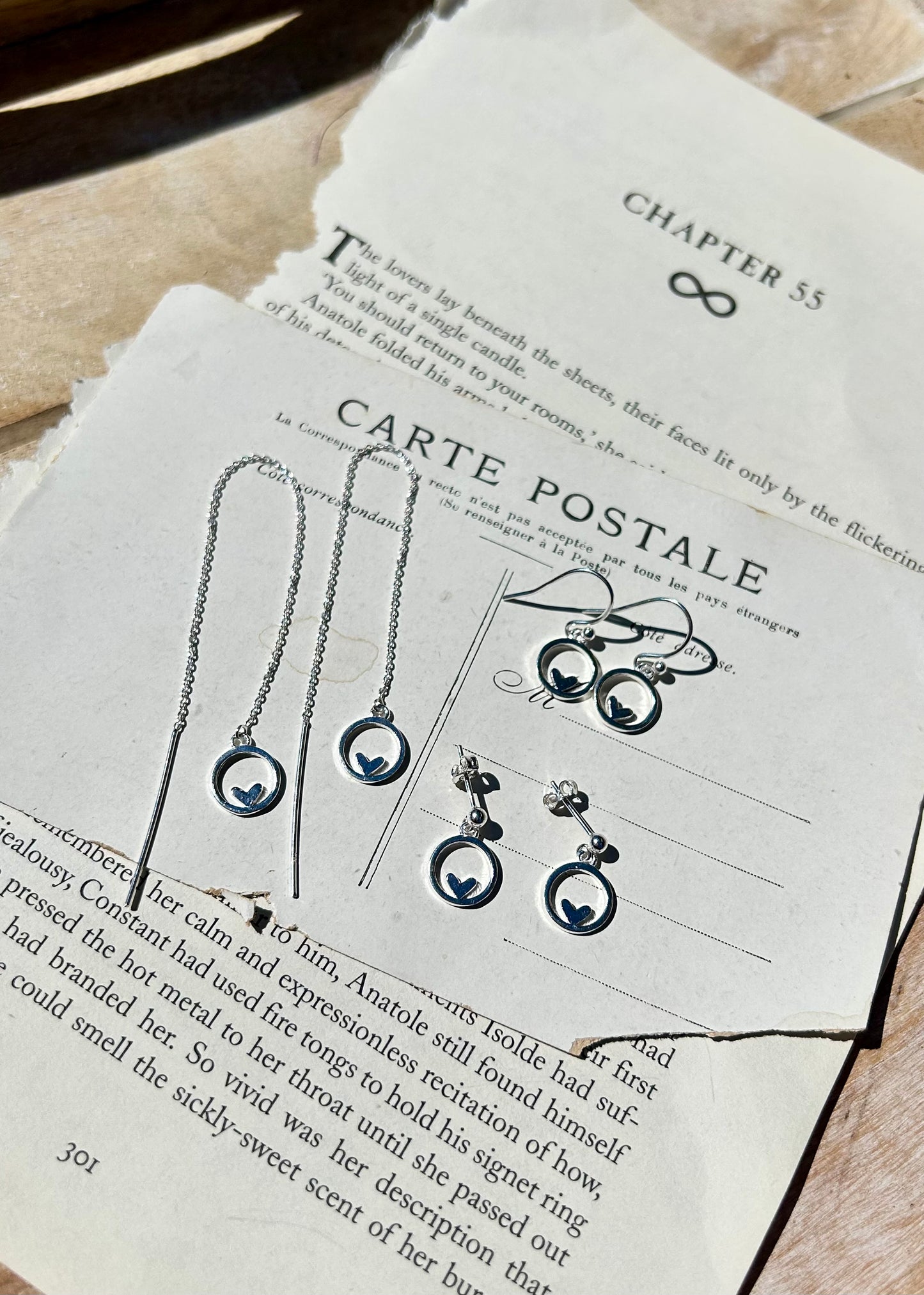 Heart in circle dangly stud earrings